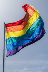 Rainbow flag blowing in the wind in the Castro District San Francisco - obrazy, fototapety, plakaty