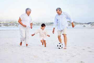 Beach, football and grandparents playing with kid on vacation or holiday happy for sand soccer or...