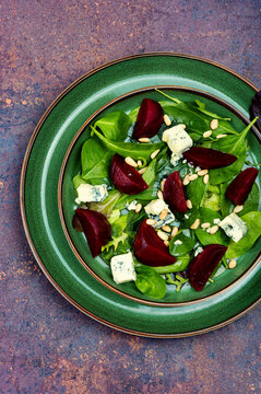 Fresh salad with beets, cheese and greens.