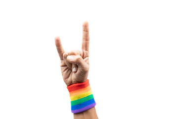 Male hand doing the hard rock sign with lgtbi flag bracelet, isolated.