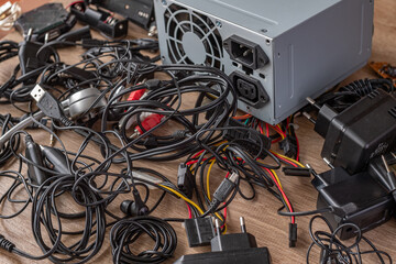 Bunch of old wires, connections, headphones and chargers for electronic devices Old wires,...
