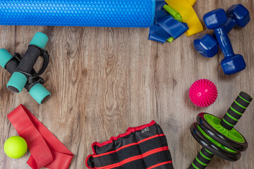 Sports and training equipment for fitness and physical education. Dumbbells, fitness roller, spiky...