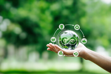 Hand-holding crystal globe with icon circular economy for carbon credit and CO2 emissions...