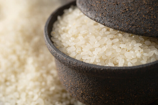 raw rice in stone bowl
