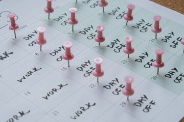 4 day work week printed calendar with pink pins on three days off in week weekend days four day...