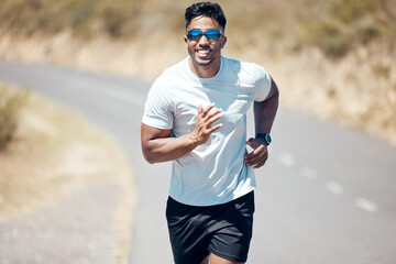 Happy man, fitness and running on road for workout, cardio exercise or training in nature. Fit,...