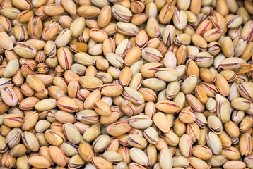 Pistachios at a market. Nuts with shell close-up.
