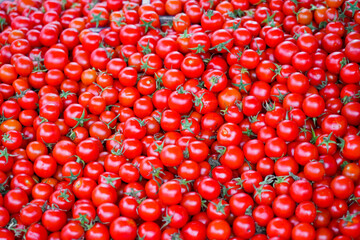 Fresh red tomatoes at a market. Vegetable background.
