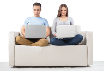 Smiling Couple Using Laptop on the Couch