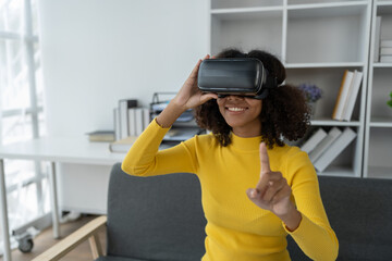Stylish cheerful african american woman in vr headset spread arms and smiling while dancing and raising fingers in cyberspace. Metaverse vr future girl concept.