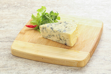 Blue cheese piece over board