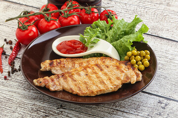 Grilled pork steak with ketchup