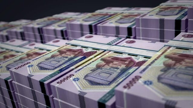 Uzbekistan money Uzbek Sum money pack loop 3d animation. Loopable seamless concept of finance, cash, economy, business and bank. Camera moving over the 50000 UZS banknote bundle stacks.