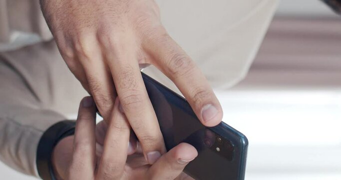 Vertical shoot. Close-up shoot of phone and human hands texting online messages. Man using gaget for communication and surching in internet. Concept of people and technologies.