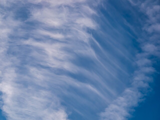 Clouds - cirrus cloud - in the shape of a waterfall in the blue sky