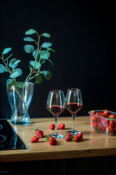 wine glasses and fresh strawberries