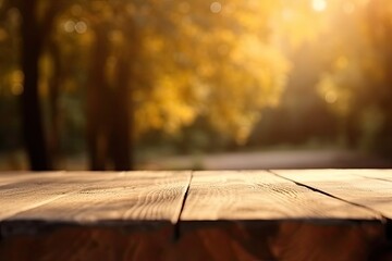 Wooden table in front of blurred autumn foliage background. Ready for product display montage