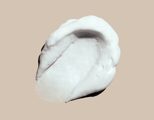 texture foam mousse foam cosmetic smear sample on beige background