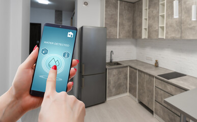 smart phone with home control application with water detected