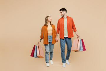 Full body young smiling happy couple two friends family man woman wears casual clothes hold...