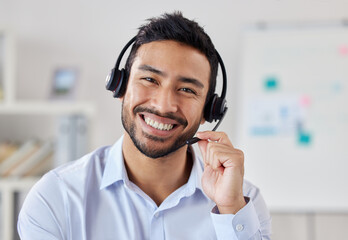 Portrait, call center and Asian man smile for telemarketing, customer service or technical support....