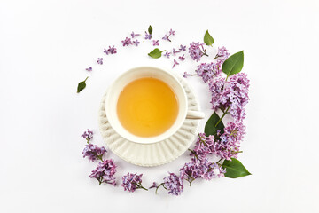 Obraz na płótnie Canvas herbal tea with lilac flowers, view from above,
