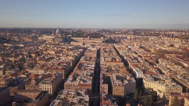 Aerial Cinematic drone downtown  Piazza Rome Italy birds flying past buildings and streets of Vatican City St Peters Europe Sistine Chapel square morning downward movement