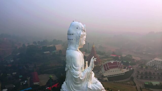 Enormous white statue of Guan Yin in thai Wat Huay Pla Kang temple.
