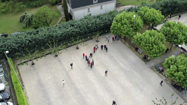 Aerial Shot of People Playing Petanque Ball Game Outdoors on Court