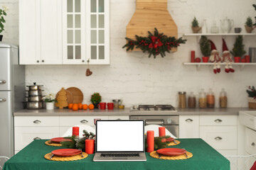Laptop on the christmas table. Video call with the family