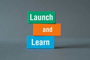Launch and Learn - word concept on building blocks, text