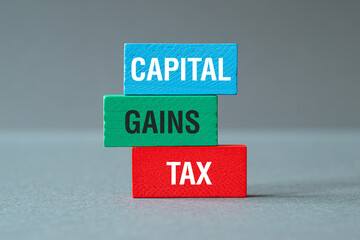 Capital gains tax - word concept on building blocks, text