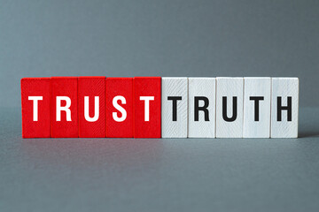 Trust truth - word concept on building blocks, text
