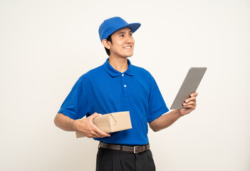 Asian man in blue uniform standing holding digital tablet computer on isolated white background. Male service worker with cell phone. Delivery courier shipping service