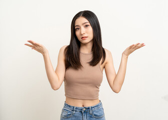 Upset confused bad emotional asian woman. Unhappy stressed female. Young lady standing feeling depressed dramatic scene on isolated background.