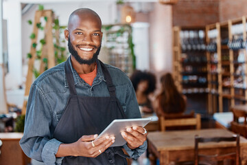 Restaurant, tablet and portrait of man or small business owner, e commerce and cafe or coffee shop management. Happy waiter or african person with sales on digital technology or internet for startup