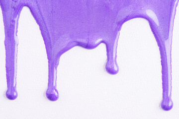 Close up of red paint drops on white paper background. Red nail polish. Sample of makeup in lavender color.