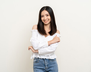 Beautiful smiling happy young asian woman age around 25 in white shirt. Charming female lady standing pose on isolated white background. Asian cute people looking camera confident with backdrop.