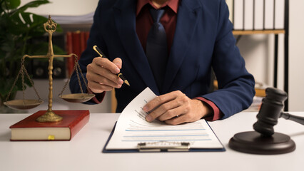 Male lawyer working with law book, A legal binding, Unilateral contract, Multilateral,...
