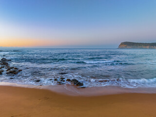 Aerial sunrise seascape with a hazy clear sky