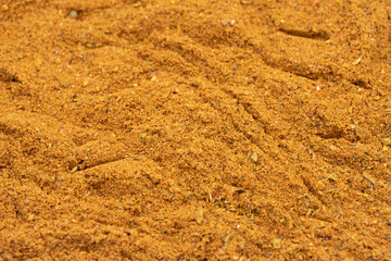 Pile of cajun powder as background, spice or seasoning as background. Close-up cajun powder