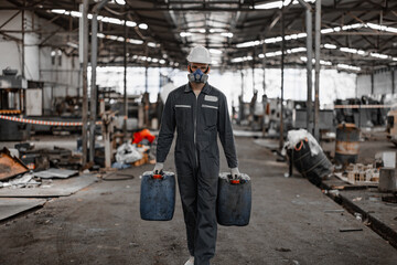 Fototapeta premium Industrial waste inspector examines the correct storage of hazardous chemicals, radioactive materials, toxic substances. Analyzing impact of factory's existing projects, suggesting solutions