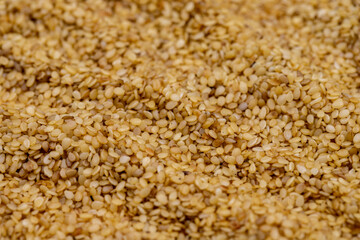 Pile of sesame seeds as background, spice or seasoning as background. Close-up Sesame seeds