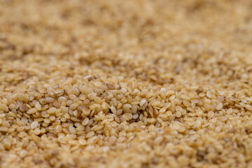 Pile of sesame seeds as background, spice or seasoning as background. Close-up Sesame seeds