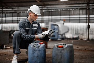 Industrial waste inspector examines the correct storage of hazardous chemicals, radioactive materials, toxic substances. Record field conditions on paperwork, collect data, and report to supervisor.