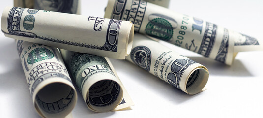 Close up of role money dollar tied with rope on white background.