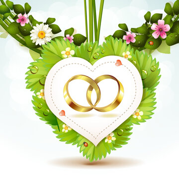 Two wedding ring on white shape heart