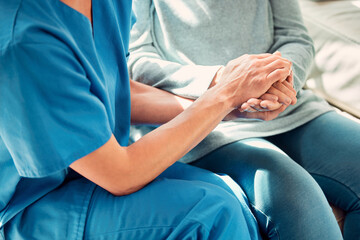 Holding hands, support and nurse with senior patient for care and trust in a nursing home for...