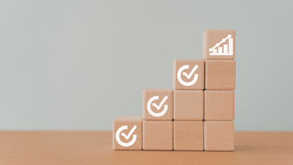 For Corporate regulatory and compliance. Goals achievement and business success. Checklist on wooden cube block and increasing graph on top