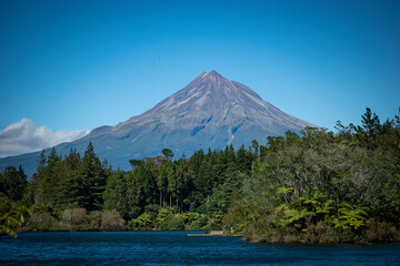 Fototapeta premium New Zealand, Mount Taranaki is the symmetrical volcanic cone that rises from sea level to 8,260 ft (2,518 m). This mountain is located in Egmont National Park, North Island of the New Zealand.
